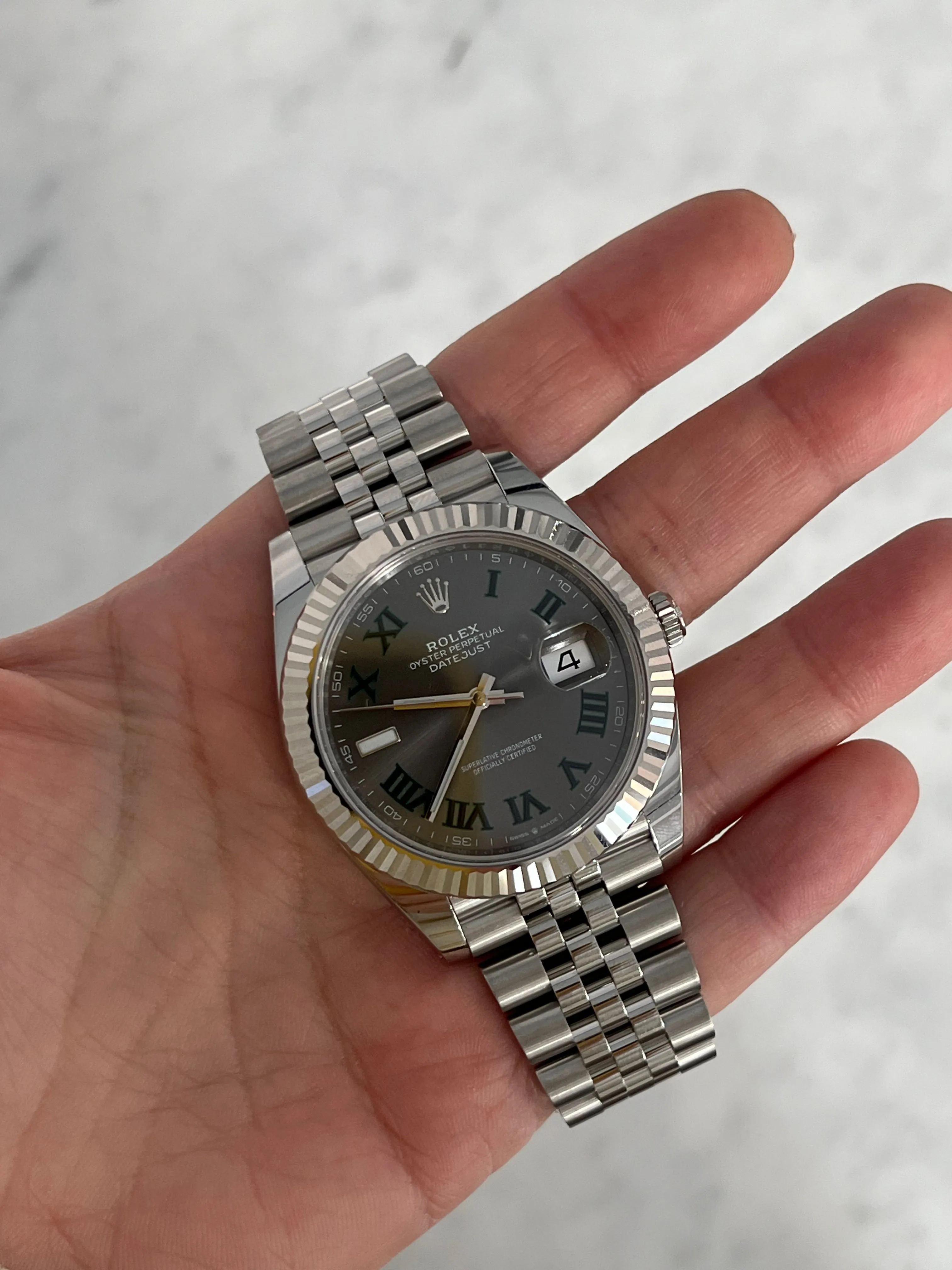 Sure! The optimized title for this e-commerce product in English using modifiers could be Rolex Datejust 41mm Wimbledon Dial Stainless Steel Mens Watch.